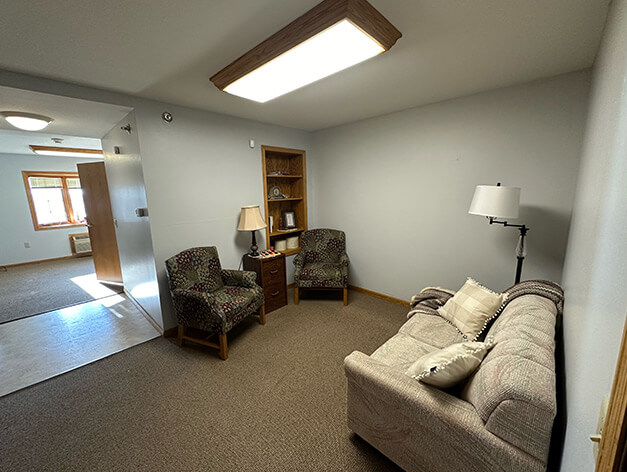 Assisted living apartment living room at Good Samaritan Society - Bloomfield.