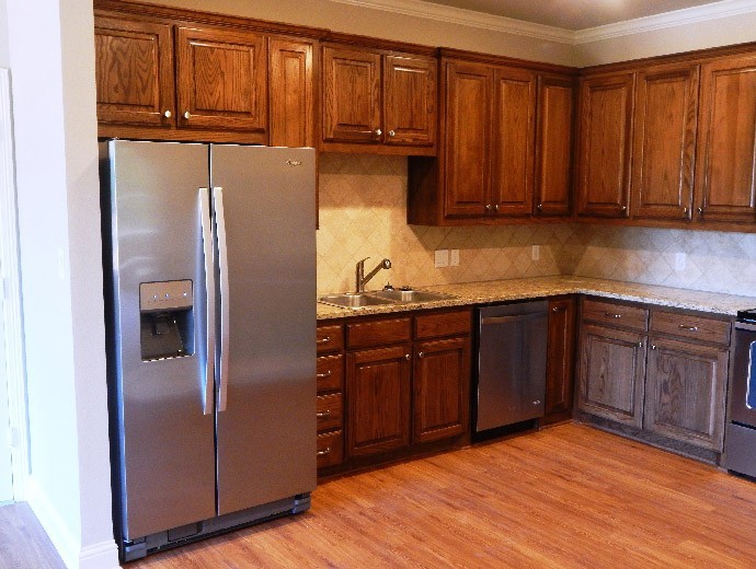 Spacious kitchen boasting of stainless steel appliances available in the independent living twin homes at Good Samaritan Society - Lake Forest Village in Denton, Texas.