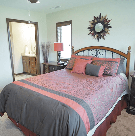 Good Samaritan Society - Grand independent living twin home bedroom with walk-in bathroom