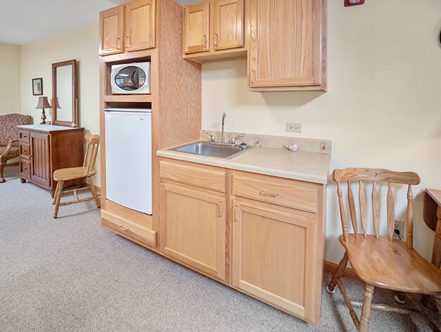 Victorian Legacy assisted living apartment kitchenette at Good Samaritan Society - Superior