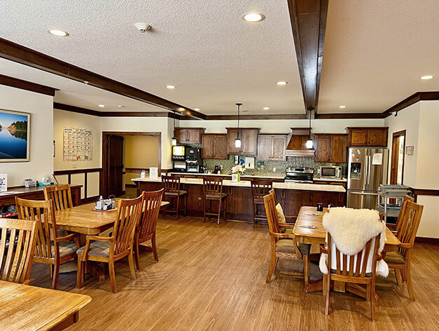 Community dining room at The Lodge of Taylors Falls by Good Samaritan Society.