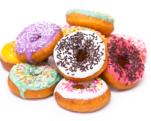 Delicious stack of donuts with frosting and sprinkles.