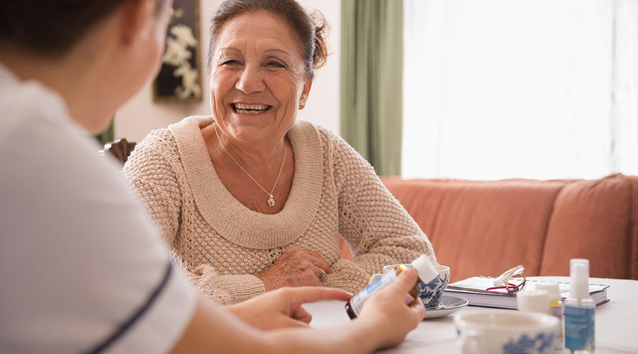 Woman discussing medications with a medical professional.