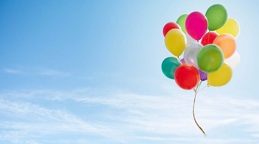 Colorful balloons floating high in the sky.