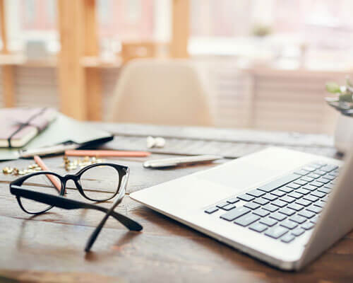 Eye glasses and computer.