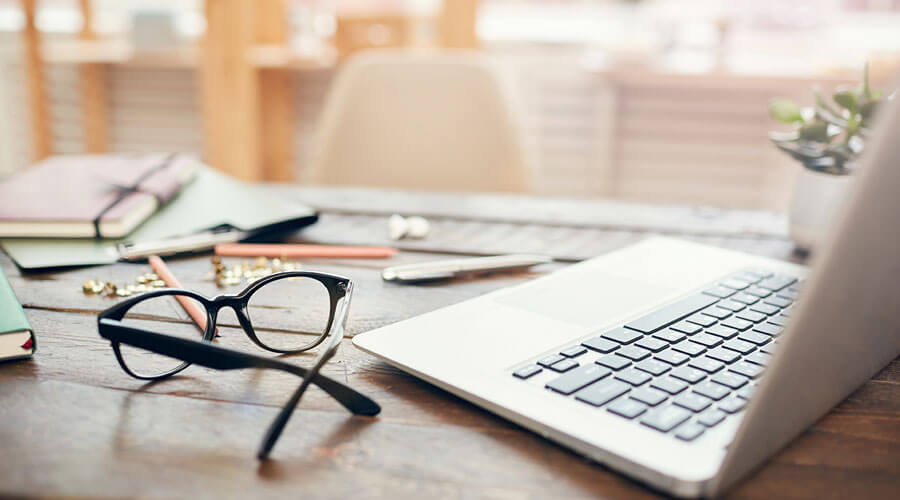 Eye glasses and computer.