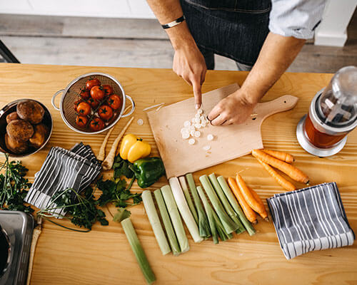 Vegetables being chopped on a cutting board