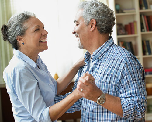Couple dancing in a house.