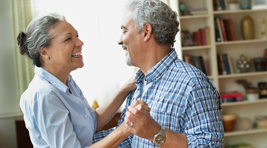 Couple dancing in a house.