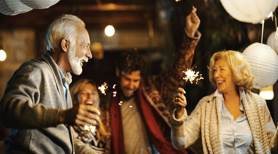 People dancing with sparklers.