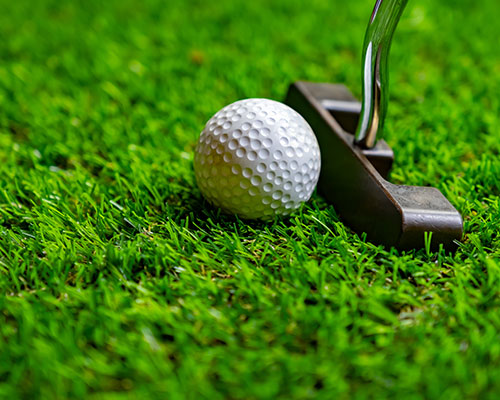Golf ball and putter.