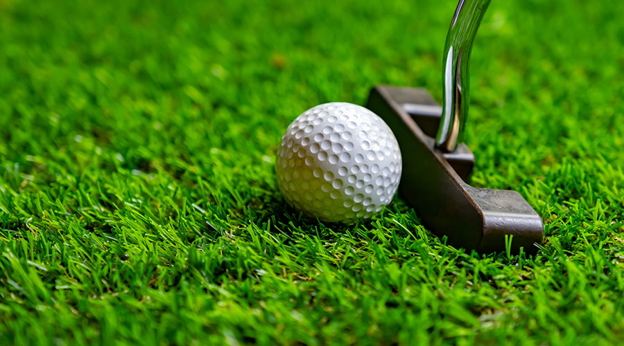 Golf ball and putter.