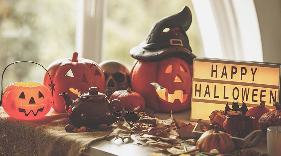 Pumpkin wearing a witch hat.