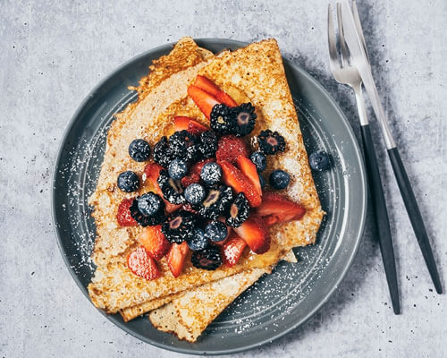 Breakfast topped with fruit.