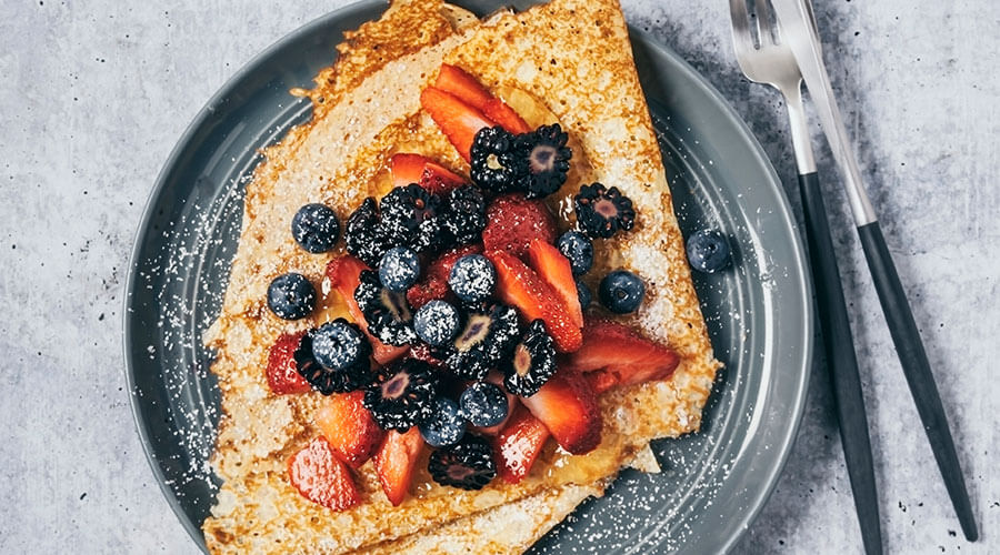 Breakfast topped with fruit.