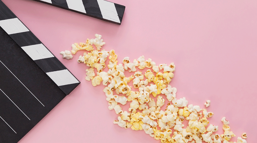 Popcorn and movie clapperboard.