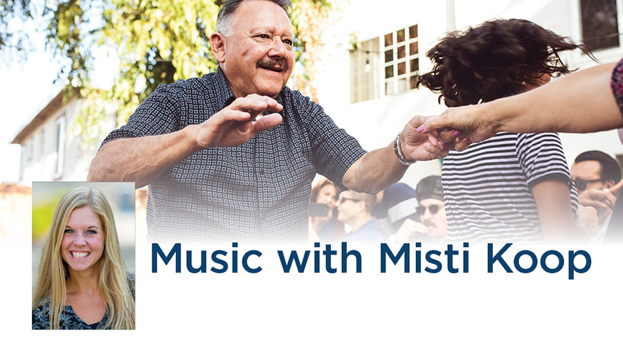 Man dancing and a picture of Misti Koop.