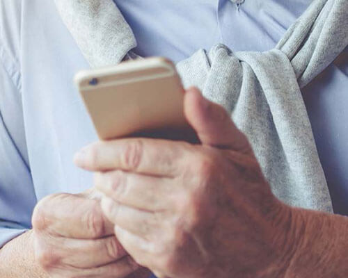 Man holding cell phone.