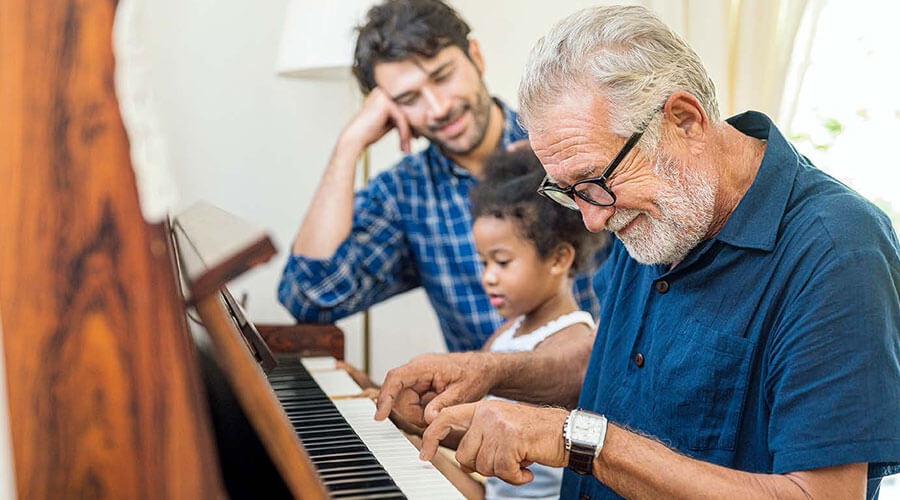 Family playing the piano