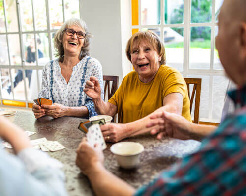 Playing cards at a table.