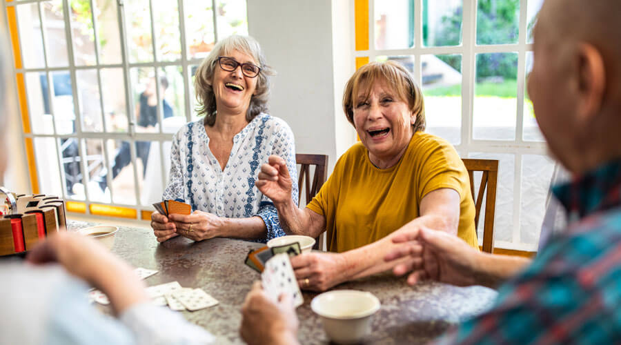 Playing cards at a table.