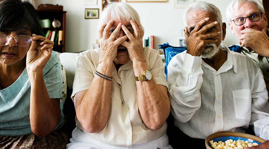 Two people covering their eyes.