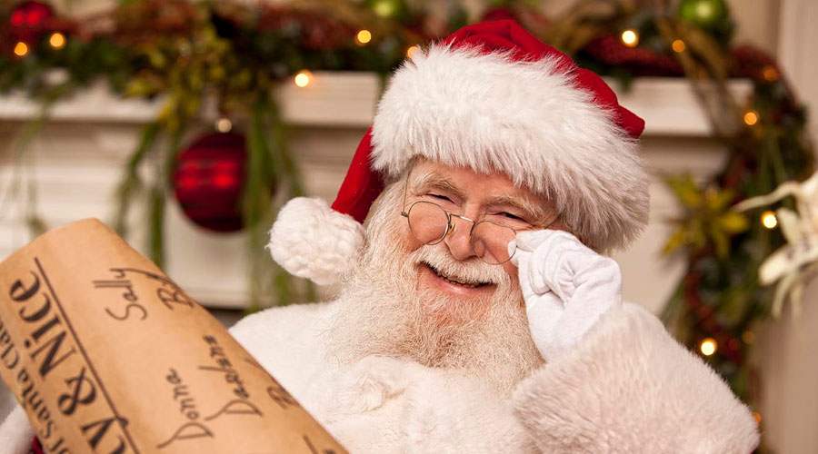 Santa holding his naughty and nice list.