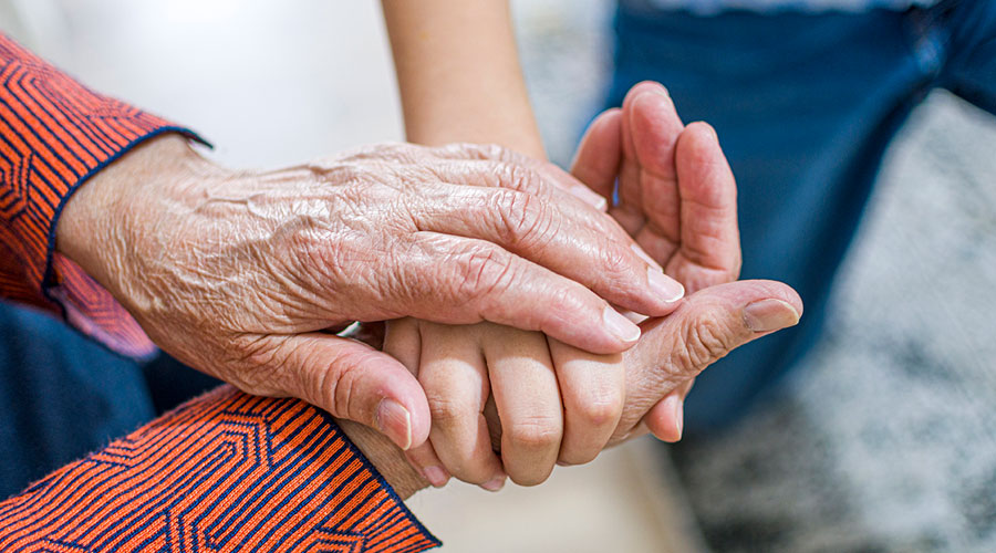 3 hands holding each other.
