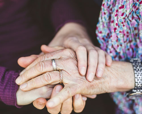 Stack of hands being held.