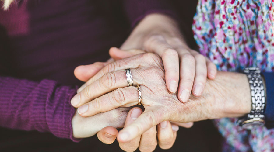 Stack of hands being held.