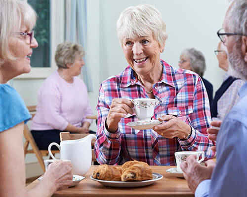 Senior friends enjoying tea time.
