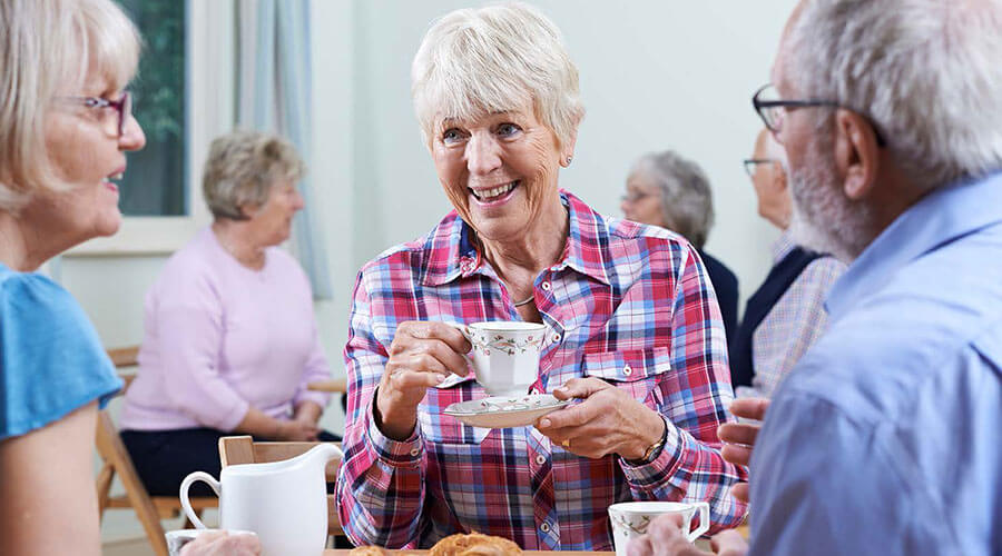 Senior friends enjoying tea time.