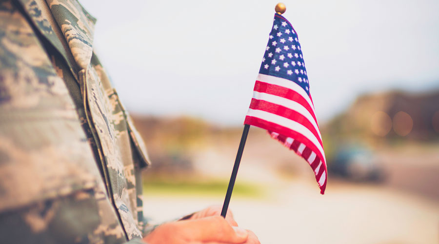 Veteran holding a flag.