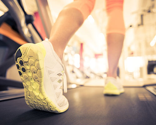 Walking on a treadmill.