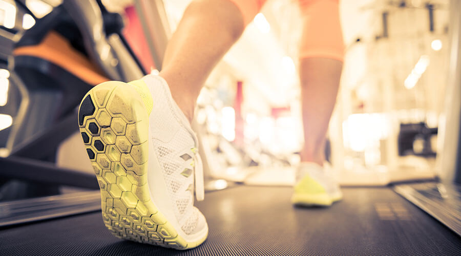 Walking on a treadmill.