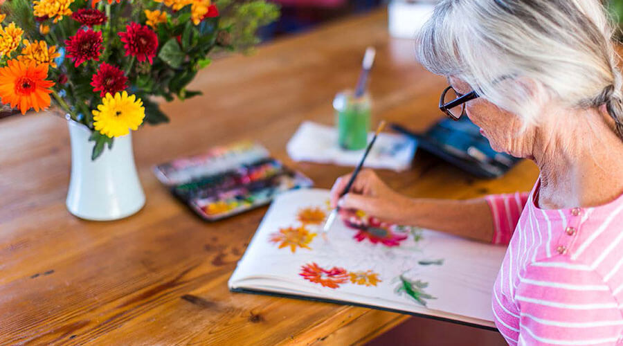Woman painting with watercolors