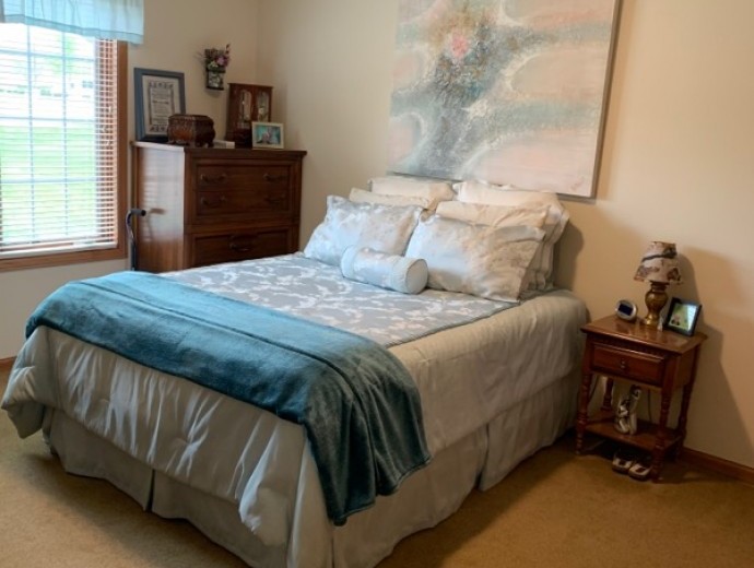 Spacious bedroom with natural light available for assisted living residents at Good Samaritan Society - Algona in Algona, Iowa.