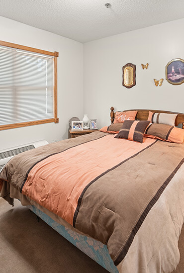 Assisted living apartment bedroom at Good Samaritan Society - Arlington
