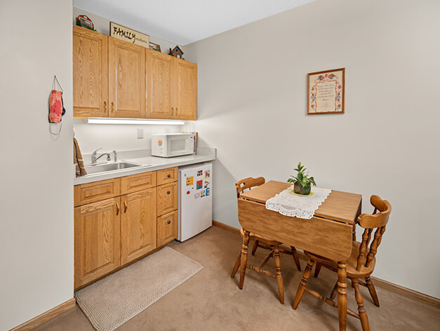 Assisted living apartment kitchenette at Good Samaritan Society - Arlington