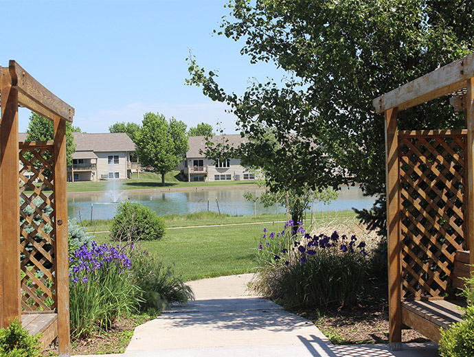 Relax on the benches while looking out across the pond at Good Samaritan Society - Beatrice in Beatrice, Nebraska.