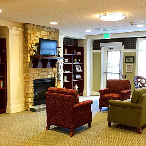 Assisted Living lounge with fireplace at Good Samaritan Society - Fairfield Glade in Crossville, Tennessee.