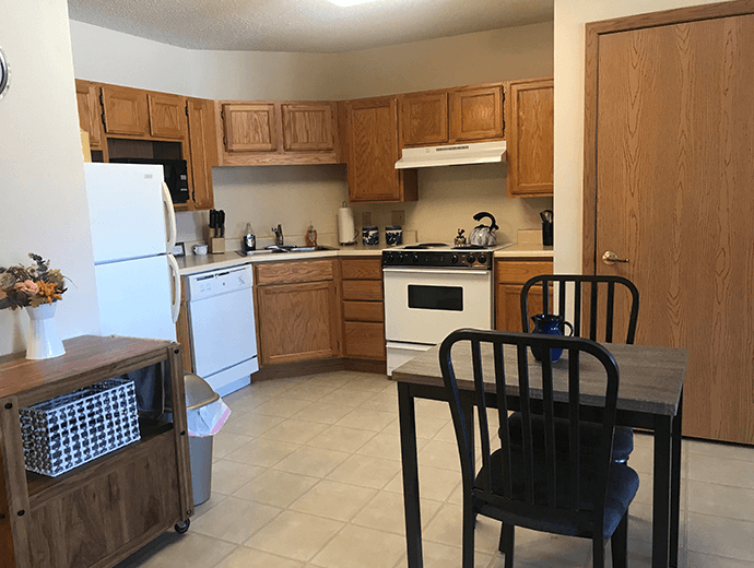 Cozy kitchen with appliances available in Heritage Court independent living apartments at Good Samaritan Society - Davenport in Davenport, Iowa.