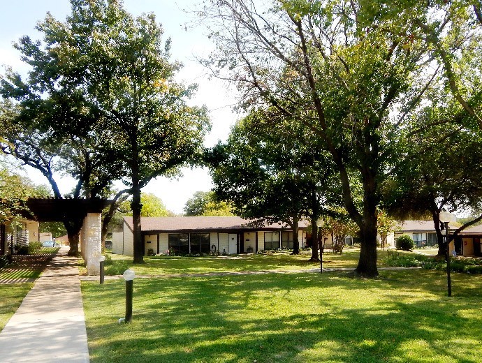 Walking path leading to independent living cottages available at Good Samaritan Society - Lake Forest Village in Denton, Texas.