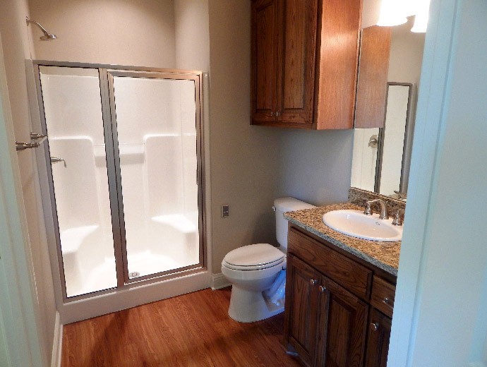 Updated master bathroom with walk-in shower at Good Samaritan Society - Lake Forest Village in Denton, Texas.