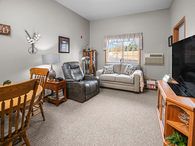 Assisted living apartment living room Good Samaritan Society - Edgebrook Care Center
