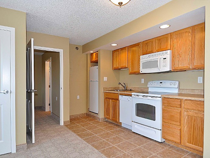 Senior living apartment kitchen at Good Samaritan Society - Fort Collins Village in Fort Collins, Colorado.