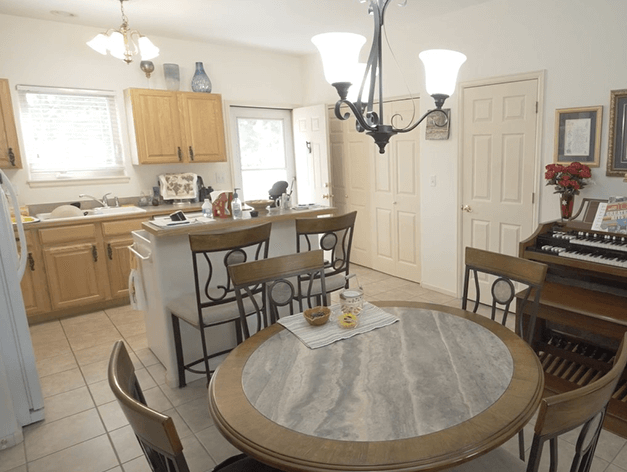 Open concept kitchen with dining room featured in our independent living twin homes at Good Samaritan Society - Fort Collins in Fort Collins, Colorado.