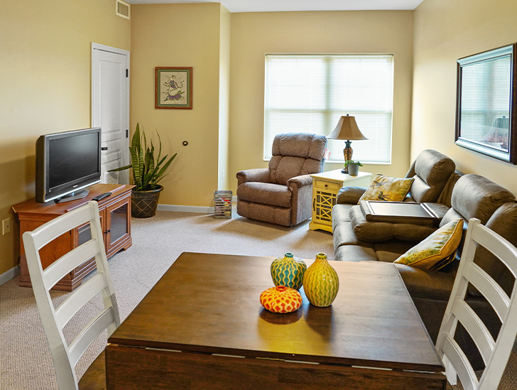 Assisted living residents can enjoy a spacious apartment living room at Good Samaritan Society - International Falls in International Falls, Minnesota.