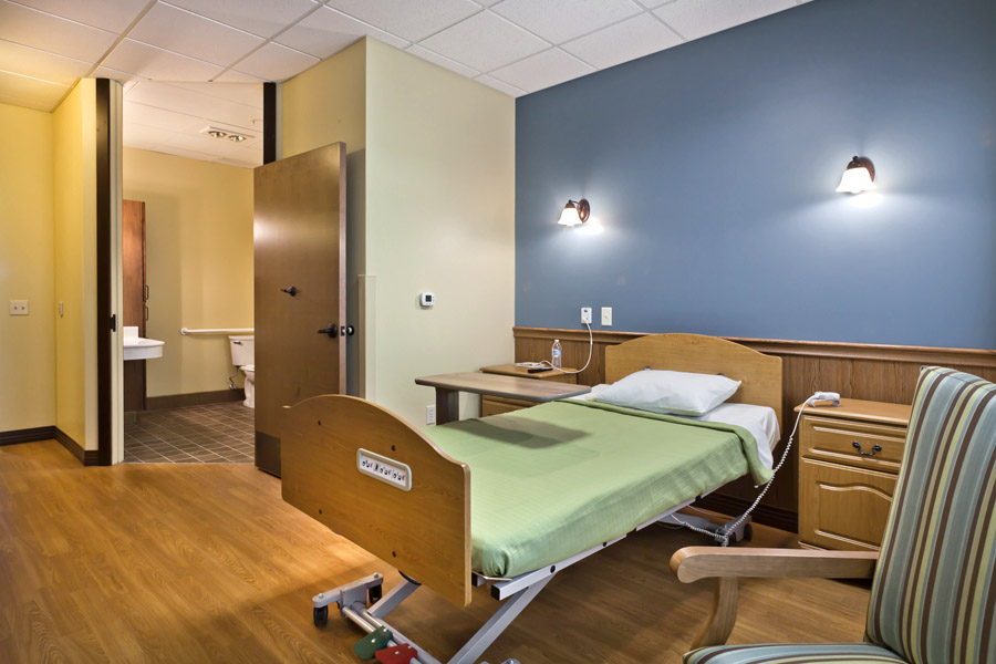 Spacious nursing home resident suite with private bathroom and calm colors at Good Samaritan Society - International Falls, in International Falls, MN.