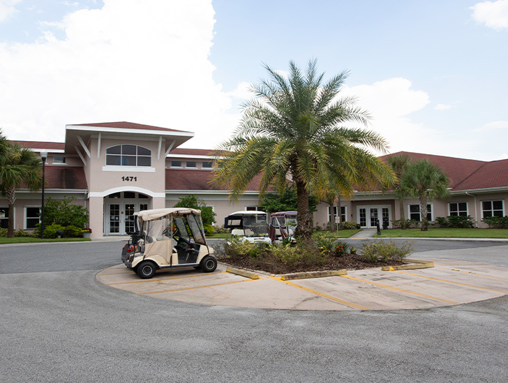 Golf cart parking available for assisted living and independent living residents at Heritage Creekside at Good Samaritan Society - Kissimmee Village in Kissimmee, Florida.